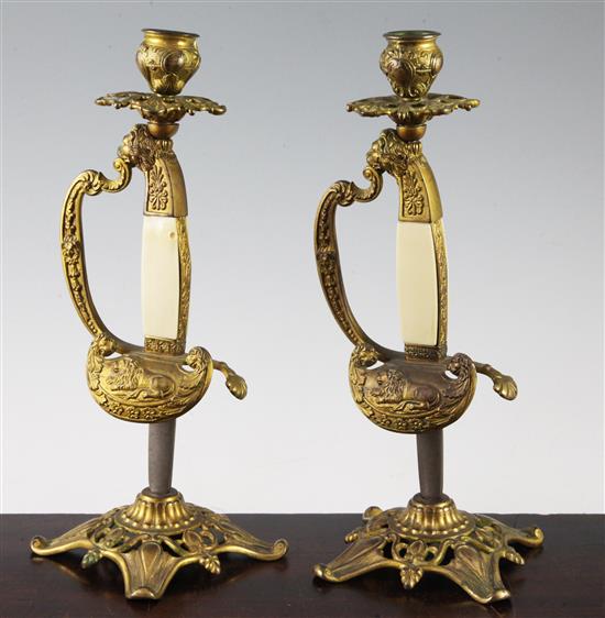A pair of late 19th century French candlesticks, 11in.